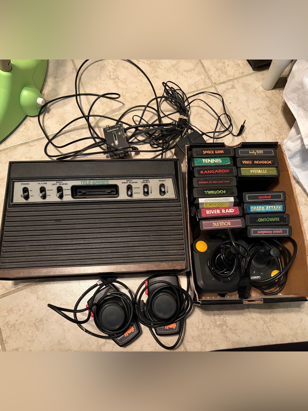 Atari 2600 Tele-Games Classic Console with Black Controllers and Game Cartridges